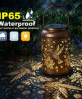 Hummingbird Solar Lanterns For Outdoor Garden Decor Waterproof Hanging Lights glowing on wet patio in rain