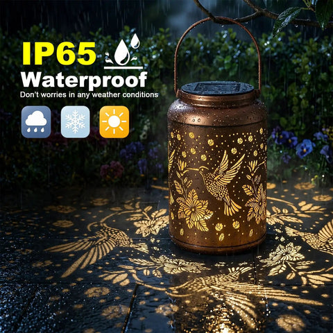 Hummingbird Solar Lanterns For Outdoor Garden Decor Waterproof Hanging Lights glowing on wet patio in rain