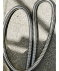 Heavy Duty Workhorse 304 Stainless Steel Corrugated Tube Flexible Metal Cable Conduit Wrap for Electrical Wiring and Plumbing Fixtures Tough As Nails Armor Sleeving One Meter Long Silver Finish on textured surface.