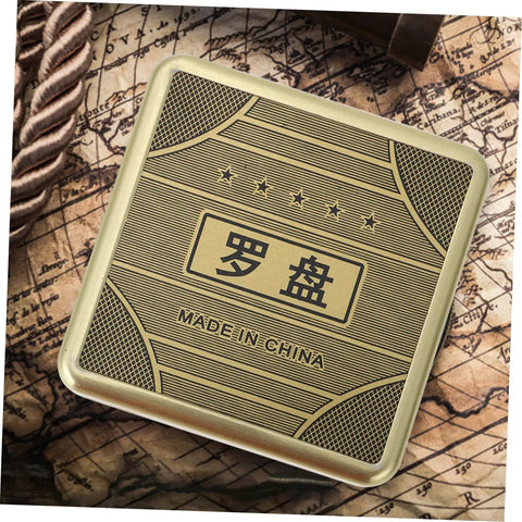 Top view of a Small 10cm Alloy Feng Shui Compass With Flip Cover, Waterproof Outdoor Navigation Tool, on an old map background.