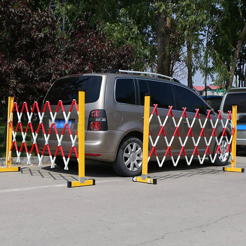 Tough As Nails Traffic Barricade Heavy Duty Industrial Crowd Control Barrier For Construction Zones And Large Gatherings Uv Resistant FRP Expandable Safety Fence Red White near parked car