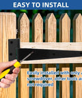 Installing T Strap Barn Door Hinges Heavy Duty 5 Inch Black Iron Gate Straps on a wooden fence with a screwdriver.
