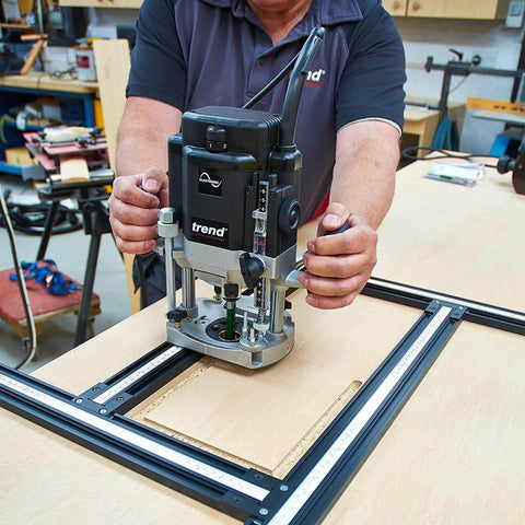 Adjustable Router Jig Frame and Guide System for Cutting Square and Rectangular Recesses, Slots, and Face Panel Molds With a Router, Large 23.6 By 23.6 Inches Working Area, Four 27.6 Inch Extrusion Rails With Dual Metric Imperial Scales Varijig in use on a wooden board.
