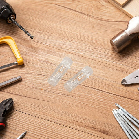 Clear Plastic Shelf Support Pegs Set for Kitchen Cabinets and Furniture Shelves on a wooden surface with tools