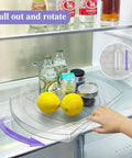 Person using Rotating Lazy Susan Turntable Organizer Rectangular 16.5 Inch By 11.1 Inch in fridge with bottles and lemons