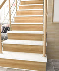 Staircase with Natural Brown Wood Contact Paper Peel And Stick For Cabinets, Countertops, And Furniture, Waterproof Woodgrain Wallpaper Self Adhesive Removable 15.7x118 Inch Roll on steps.