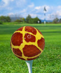 Giraffe Fullwrap Novelty Golf Ball on tee with giraffe print, part of 12 pack for gifts tourneys league events collectors yellow print