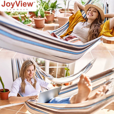 Two women relaxing in a Single Person Brazilian Hammock With Carry Bag And Strong Ropes, ultra comfortable cotton polyester.