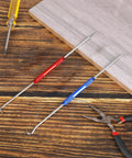 Hella Tough Dual End Metal Scribe Set With Straight Hook And Angled Picks four tip marking tools on wooden surface.