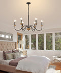 6 Light Wood Chandelier For Dining Room Black Farmhouse Style Modern Light Fixtures Over Table Cool Cozy Rustic Candle Ceiling Chandelier For Living Room Bedroom Entryway Kitchen 32.5 Inch Diameter hanging in a bedroom.