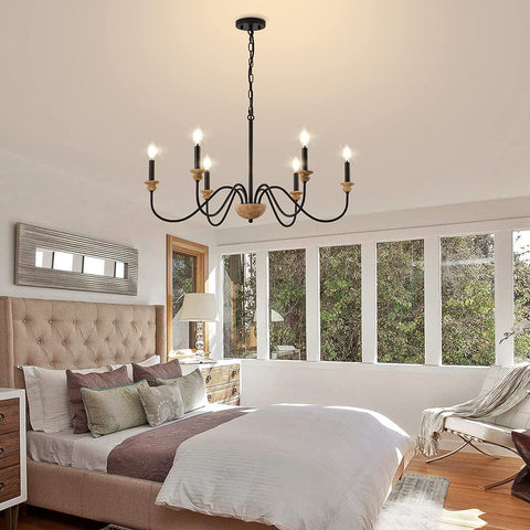 6 Light Wood Chandelier For Dining Room Black Farmhouse Style Modern Light Fixtures Over Table Cool Cozy Rustic Candle Ceiling Chandelier For Living Room Bedroom Entryway Kitchen 32.5 Inch Diameter hanging in a bedroom.