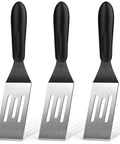 Three-piece stainless steel spatula set with black handles; slotted blades for cooking and serving