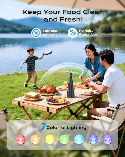 Family dining outdoors with Tabletop Fly Fans With USB Type C Rechargeable Battery And Colorful LED Light Show on a picnic table.