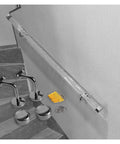 Top Notch Clear Acrylic Railing System Featuring Sleek Silver Brackets, components including posts, mounting hardware on stairs.