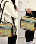 Person carrying Desert Bloom Insulated Lunch Bag with handles and shoulder strap, large capacity, desert scene print.