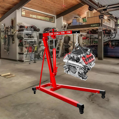 Heavy Duty 5000 Lbs Engine Hoist Cherry Picker with smooth hydraulic lift holding an engine in a garage.