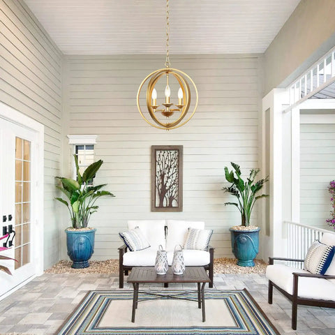 Gold Orb Three Light Chandelier With Adjustable Ring Orbits Modern Globe Hanging Lights Fixture over patio seating area