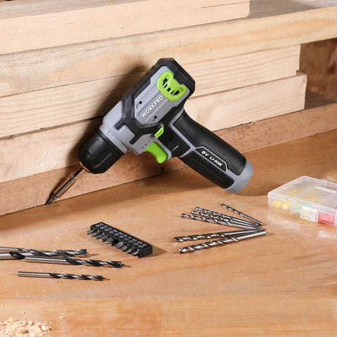 Eight Volt Cordless Drill Driver Kit With 53 Piece Bit Set, 2.0Ah Battery, Three Eighths Inch Keyless Chuck on wooden surface