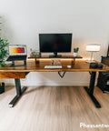 Flex Your 60 Inch Workspace With This Dual Motor Electric Standing Desk Crafted From Solid White Oak Featuring A Hidden Storage Drawer And Sleek White Frame, showcasing a stylish ergonomic setup.