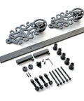 Ornate Black Iron Sliding Barn Door Hardware Kit for Single Door with 5.5 Foot Track, heavy duty parts, includes rollers and stoppers.