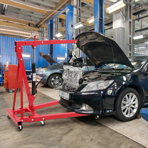 Solid 2 Ton Engine Hoist And Rolling Cherry Picker With Reinforced Casters For Garages And Shops lifting engine in auto shop.