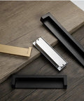 Rock Solid Zinc Alloy Recessed Handles For Kitchen Cabinets Set Of Two Black Inset Hidden Flush Drawer Pulls on wood surface.