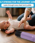 Rock Solid Electric Breast Milk Cooler Featuring Dual Four Ounce Insulated Storage Bottles, Usb C Powered Portable Nursing Chiller on a wooden floor with a baby.