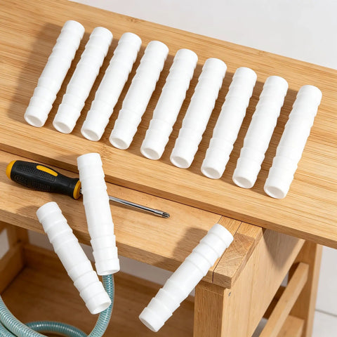 Ditch The Leaky Hose With This Awesome 1/2 Inch Repair Kit Featuring Eight Sturdy Plastic Connectors And Tight Clamps Perfect For Garden Hoses, Aquariums, Or DIY Plumbing Fixes That Save You Cash And Time While Standing Up To Any Weather. white 1/2 inch plastic hose connectors on wooden surface