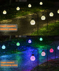 4 Pack Solar Lanterns With Shepherd Hooks No Wiring Easy Setup Outdoor Color Changing Crackle Glass 3 Lumens Waterproof Garden Lights showing warm yellow and changing color modes along a pathway at night.