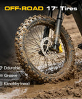Powerful 7000W Peak Electric Dirt Bike for Adults with muddy 17 inch dirt tires and dual suspension on trail