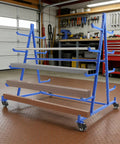 Rock Solid Heavy Duty Five Tier Rolling Lumber Rack Built Like A Tank Holds 500 Pounds No Sweat Garage Workshop Storage For Conduit Pipe And Yard Tools Blue with adjustable arms and multiple shelves.
