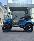 Pick Up Speed Without Breaking A Sweat On This Reliable Two Seater Electric Golf Cart Featuring A Cool Blue Exterior Black Hardtop Canopy Bright Led Headlights Full Windshield And Sturdy Bumper For Lazy Weekend Cruising, side view in urban setting.