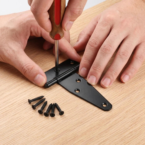 Heavy Duty 2 Inch T Hinges With 36 Screws For Outdoor Use Black T Strap Hinges For Wooden Fence Shed Doors Barn Doors Gate Hardware Ideal For Outdoor Projects. black 2in metal hinge being screwed into wood with matching screws