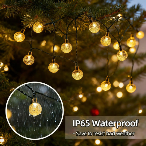 Solar String Lights Outdoor IP65 Waterproof 9.3 Feet With 20 Crystal Globe Bulbs hanging on tree during rain showing durability.