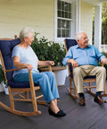 Two people sitting on navy blue Indoor Outdoor Rocking Chair Cushions with Waterproof High Back Pads on a porch.