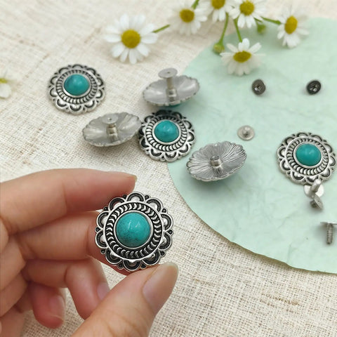 Straight Fire Green Turquoise Concho Buttons 10 Pack With Screw Back Fasteners in hand, showcasing alloy rivets with turquoise center.