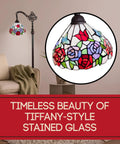 Tiffany Inspired Arched Stained Glass Floor Lamp 62 Inches Tall With Foot Switch Adjustable Shade Handcrafted Vintage Vibe For Cozy Living Room Decor In Red Purple Green Glass, displayed in a cozy room setting.