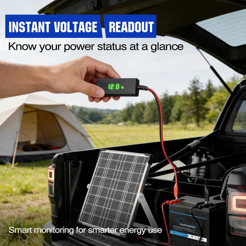 Person checking No-Nonsense 12V Solar Battery Charger With LCD Voltage Tester, 20W Trickle Charger on a truck outdoors.