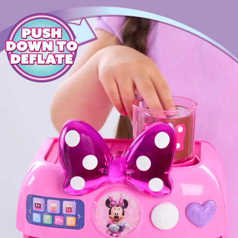 Child pouring syrup into Minnie Mouse Bowrista 10 Inch Kids Espresso Machine Play Set with Cups for pretend coffee shop fun