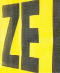 Close-up of Two Pack 18x84 Oversize Load Sign for Trucks with Bungee Cord and Hook, Stretch Cord Mesh Banner, part of warning text visible.