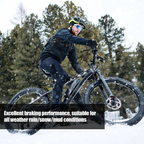 Cyclist in snow using 8 Pairs Resin Semi Metal Bicycle Disc Brake Pads Replacement for Shimano Deore XT XTR LX SLX Saint Alfine Hone