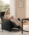 Comfy PU Leather Recliner Chair For Home Theater Seating With Lumbar Support in living room, woman reading in reclined position