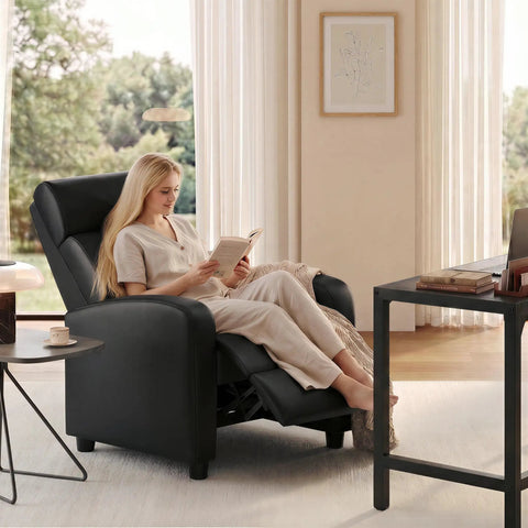 Comfy PU Leather Recliner Chair For Home Theater Seating With Lumbar Support in living room, woman reading in reclined position