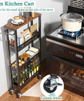 Front view of Go To Slim Four Tier Rolling Storage Cart For Narrow Spaces With Wood Top And Metal Handle Mobile Kitchen And Pantry Shelving Unit On Wheels next to a stove, showing lockable wheels and kitchen items stored on shelves.