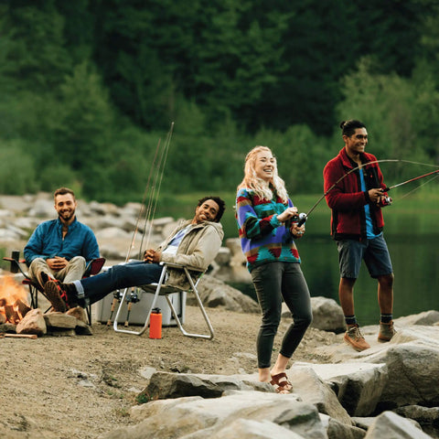 Group fishing by lake, using Telescopic Casting Rod Extends From 17 Inches To 5 Feet 6 Inches For Easy On The Go Storage.