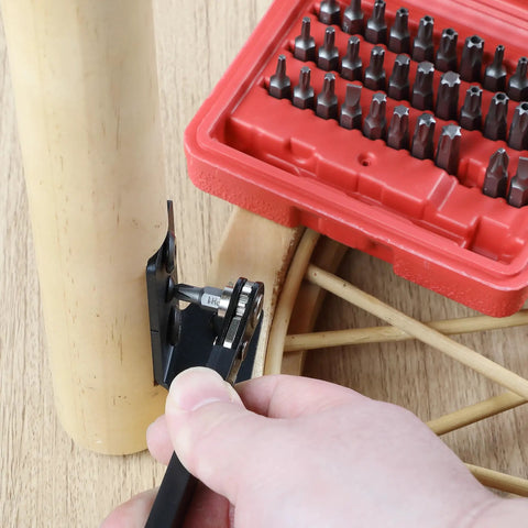 User tightening a bolt with Top Shelf Mini Ratchet Set, 34 Piece Cr-V Steel Kit With Security Bits And Right Angle Screwdriver Adapter.