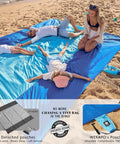 Oversized Sandproof Beach Blanket 10x9 For 2 To 8 Adults, blue quick dry mat with people relaxing, sand free, attached pouches.