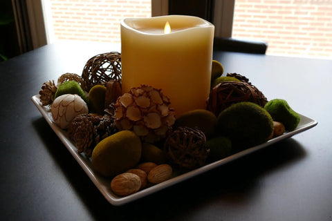 Ivory Grand Pillar Flameless LED Candle with Moving Flame on decorative plate with natural elements, battery powered real wax.