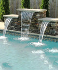 Poolside view with Pond Waterfall Kit With LED Lights And All In One Stainless Steel Spillway, showcasing water streams.