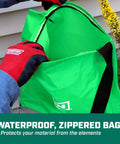 Person holding waterproof bag of Handheld Lawn Spreader With 25Lb Capacity For Grass Seed And Fertilizers, Waterproof Design